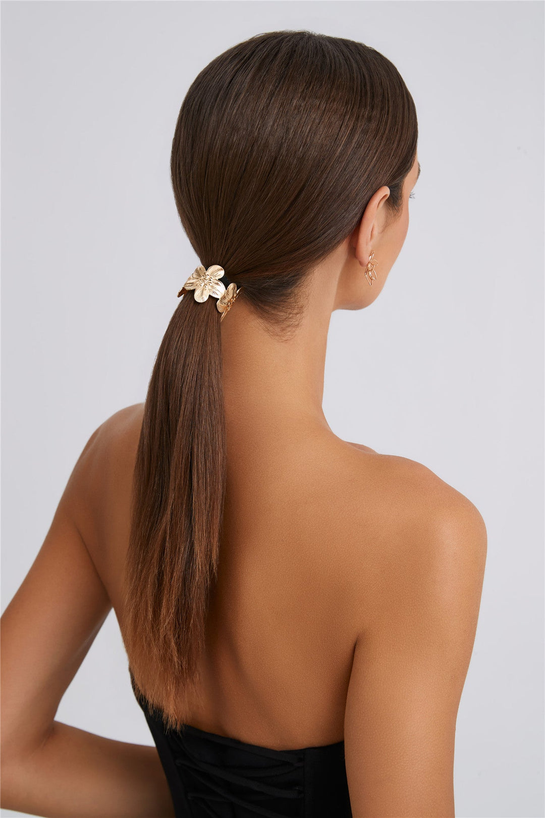 Haargummi mit Blüte in Goldoptik