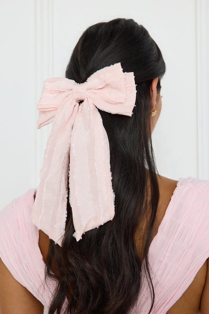 Haarspange mit rosa Schleife und Struktur